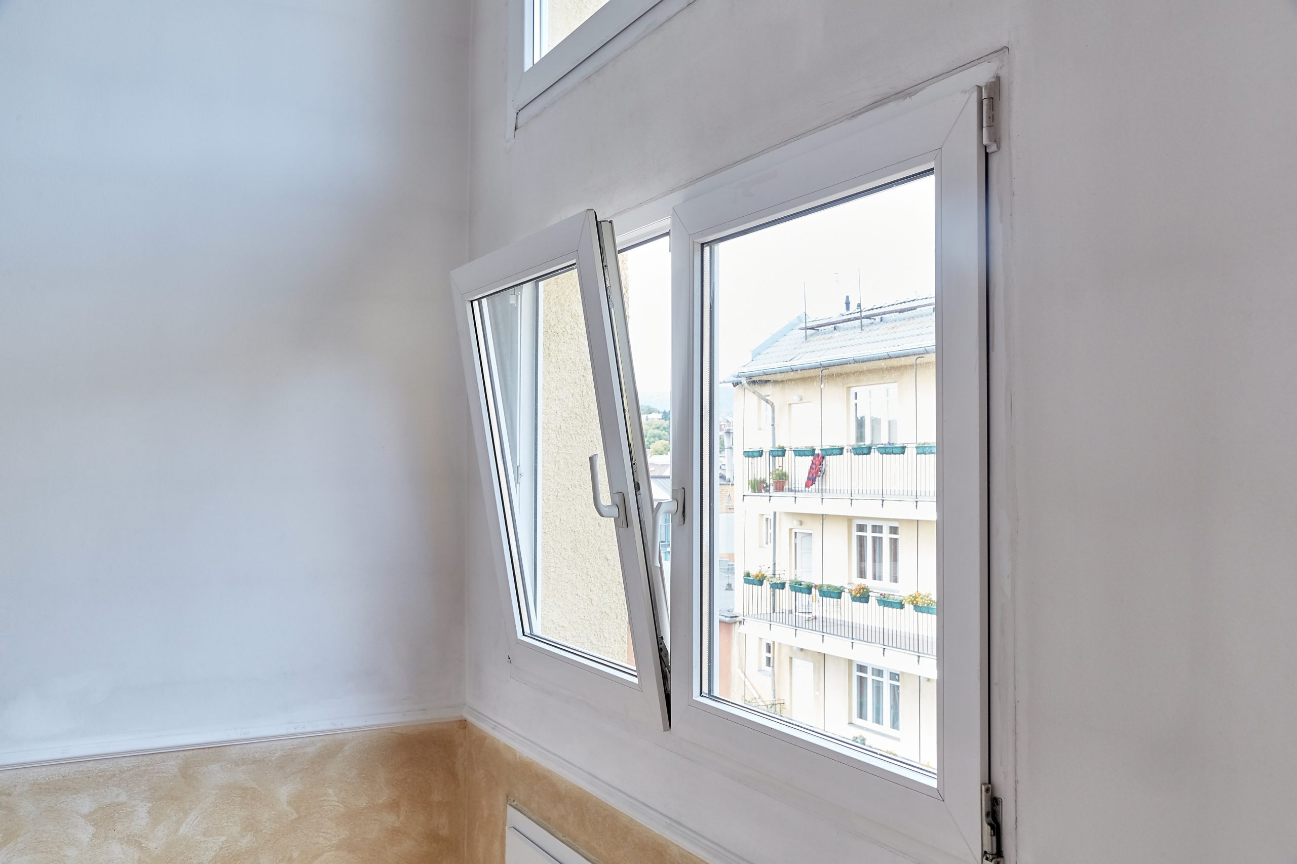 interior shot of open white upvc tilt and turn window